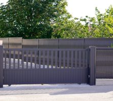dark grey gate aluminum portal with blades suburbs house street