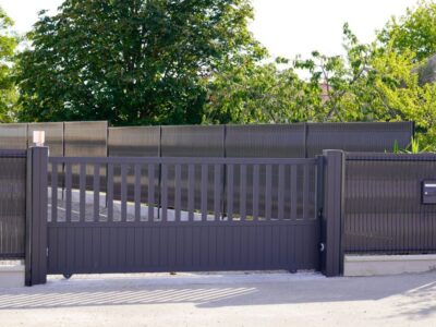 dark grey gate aluminum portal with blades suburbs house street